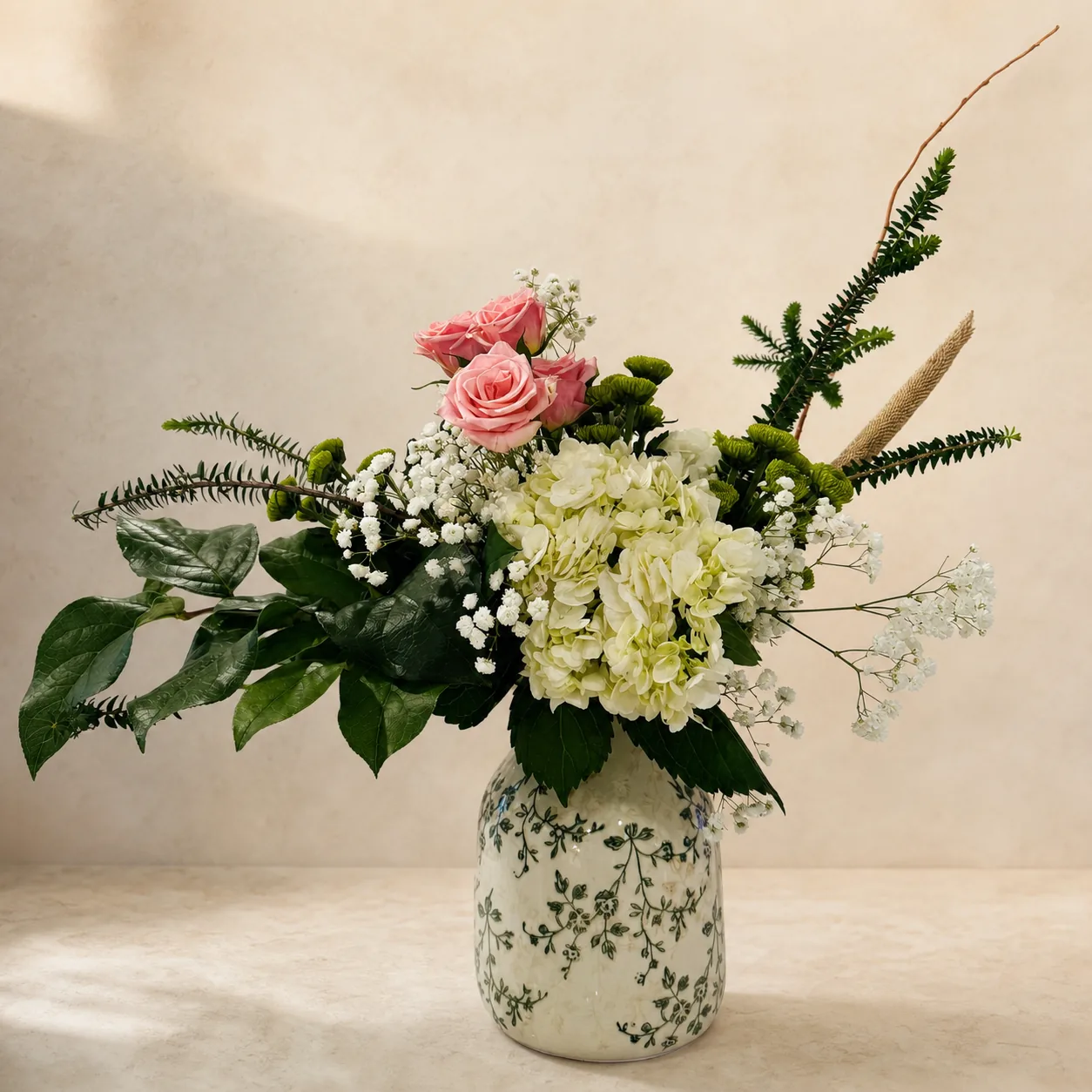 Garden-style hydrangea and rose arrangement